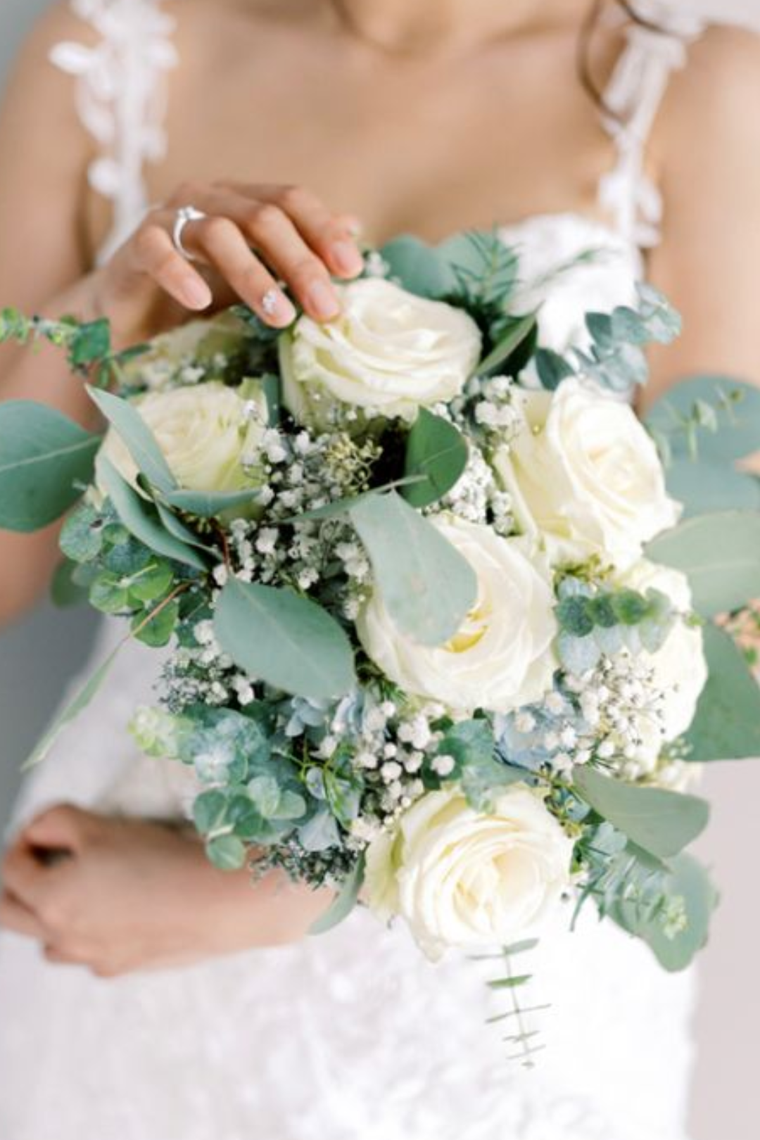Woman holding wedding flowers